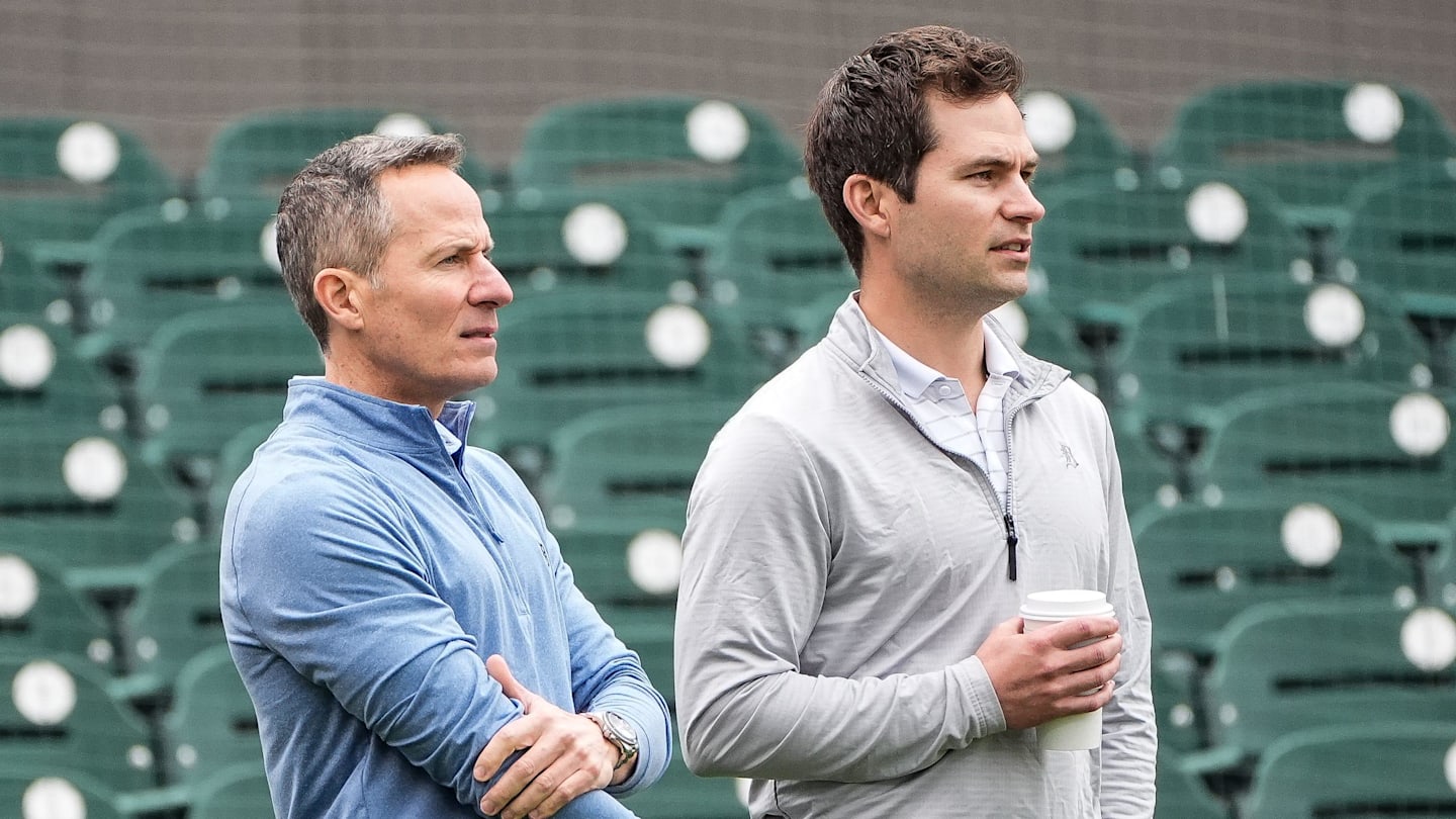 Detroit Tigers team owner Chris Ilitch, left, talks to president of baseball operation Scott Harris as they watch batting practice during spring training at Joker Marchant Stadium in Lakeland, Fla. on Thursday, Feb. 20, 2025.