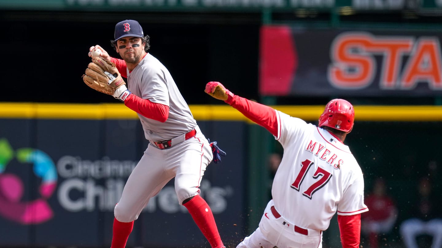 Boston Red Sox second baseman Marcelo Mayer (11) puts out Cincinnati Reds center fielder Dane Myers (17) before throwing out Tyler Stephenson to complete a double play in the second inning of the MLB Interleague game between the Cincinnati Reds and the Boston Red Sox at Great American Ball Park in downtown Cincinnati on Sunday, March 29, 2026. The game was scoreless after three innings.