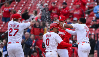Apr 1, 2026; St. Louis, Missouri, USA; St. Louis Cardinals shortstop Masyn Winn (0) is mobbed by teammates after hitting a walk-off one run single against the New York Mets during the eleventh inning at Busch Stadium. Mandatory Credit: Jeff Curry-Imagn Images
