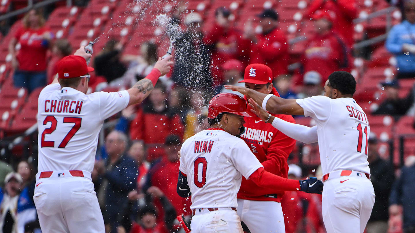 Apr 1, 2026; St. Louis, Missouri, USA; St. Louis Cardinals shortstop Masyn Winn (0) is mobbed by teammates after hitting a walk-off one run single against the New York Mets during the eleventh inning at Busch Stadium. Mandatory Credit: Jeff Curry-Imagn Images