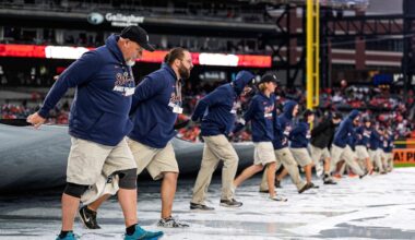 Detroit Tigers grounds crew remove the tarp from the field after the rain delay during ALDS Game 3 between Detroit Tigers and Seattle Mariners at Comerica Park in Detroit on Tuesday, Oct. 7, 2025.