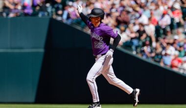 Apr 5, 2026; Denver, Colorado, USA; Colorado Rockies right fielder Mickey Moniak (22) rounds the bases on a solo home run in the fifth inning against the Philadelphia Phillies at Coors Field. Mandatory Credit: Isaiah J. Downing-Imagn Images
