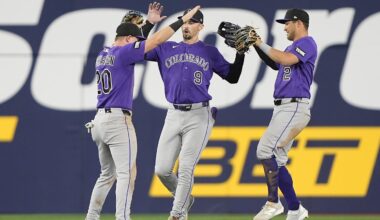 Apr 1, 2026: Colorado Rockies left fielder Troy Johnston (20) and center fielder Brenton Doyle (9)  and right fielder Tyler Freeman (2) celebrate a win over the Toronto Blue Jays after the tenth inning at Rogers Centre.