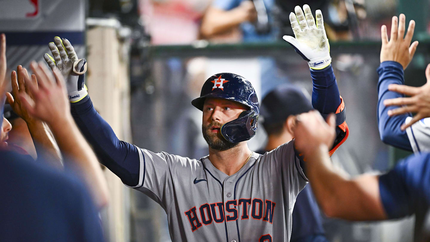 Sep 27, 2025; Anaheim, California, USA; Houston Astros first baseman Christian Walker (8) celebrates with teammates after hitting a solo home run against the Los Angeles Angels during the ninth inning at Angel Stadium. Mandatory Credit: Jonathan Hui-Imagn Images