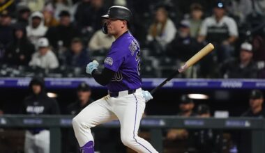 Apr 6, 2026; Denver, Colorado, USA; Colorado Rockies right fielder Troy Johnston (20) RBI doubles in the fifth inning against the Houston Astros at Coors Field. Mandatory Credit: Ron Chenoy-Imagn Images
