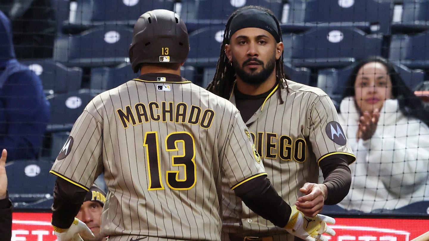 San Diego Padres right fielder Fernando Tatis Jr. greets third baseman Manny Machado.