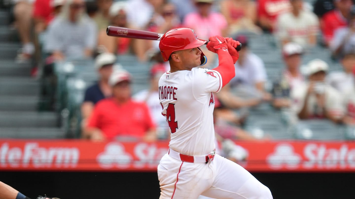 Apr 5, 2026; Anaheim, California, USA; Los Angeles Angels catcher Logan O'Hoppe (14) hits a sacrifice RBI against the Seattle Mariners during the tenth inning at Angel Stadium. Mandatory Credit: Gary A. Vasquez-Imagn Images