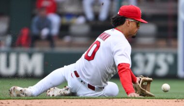 Apr 1, 2026; St. Louis, Missouri, USA; St. Louis Cardinals shortstop Masyn Winn (0) slides and fields a ground ball against the New York Mets during the eighth inning at Busch Stadium. Mandatory Credit: Jeff Curry-Imagn Images