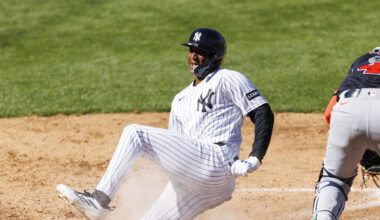 Feb 21, 2026; Tampa, Florida, USA; New York Yankees outfielder Marco Luciano (60) slides into home plate before Detroit Tigers catcher Thayron Liranzo (49) during the sixth inning in a Spring Training game at George M. Steinbrenner Field. Mandatory Credit: Morgan Tencza-Imagn Images
