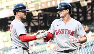 Aug 27, 2025; Baltimore, Maryland, USA;  Boston Red Sox outfielder Roman Anthony (19) celebrates hitting a solo home run during the first inning with third baseman Alex Bregman (2) against the Baltimore Orioles at Oriole Park at Camden Yards. Mandatory Credit: James A. Pittman-Imagn Images