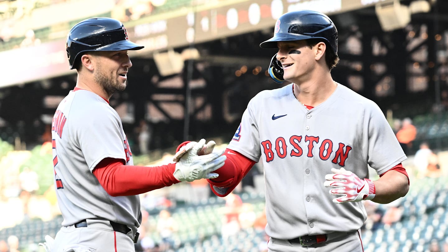 Aug 27, 2025; Baltimore, Maryland, USA;  Boston Red Sox outfielder Roman Anthony (19) celebrates hitting a solo home run during the first inning with third baseman Alex Bregman (2) against the Baltimore Orioles at Oriole Park at Camden Yards. Mandatory Credit: James A. Pittman-Imagn Images
