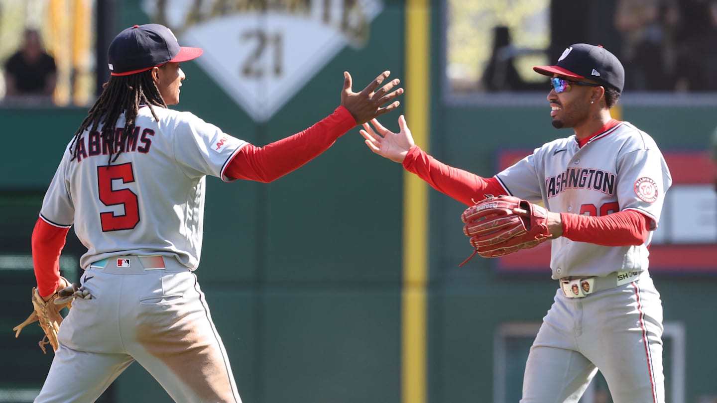 Apr 16, 2026; Pittsburgh, Pennsylvania, USA;  Washington Nationals shortstop CJ Abrams (5) and second baseman  Nasim Nuñez (right) celebrate after defeating the Pittsburgh Pirates I ten innings at PNC Park. Mandatory Credit: Charles LeClaire-Imagn Images