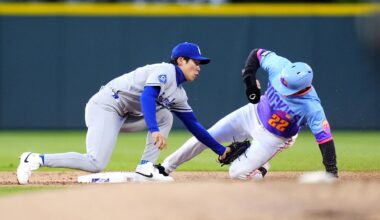 Apr 17, 2026; Denver, Colorado, USA; Colorado Rockies right fielder Mickey Moniak (22) sides safe on a steal at Los Angeles Dodgers second baseman Hyeseong Kim (6) in in the first inning at Coors Field. Mandatory Credit: Ron Chenoy-Imagn Images
