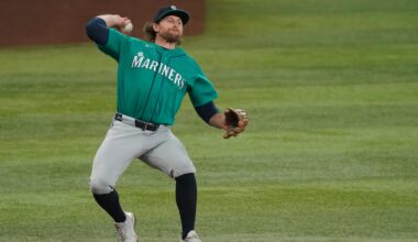 Apr 8, 2026; Arlington, Texas, USA;  Seattle Mariners second baseman Brendan Donovan (33) throws to first base during the fifth inning against the Texas Rangers at Globe Life Field. Mandatory Credit: Raymond Carlin III-Imagn Images