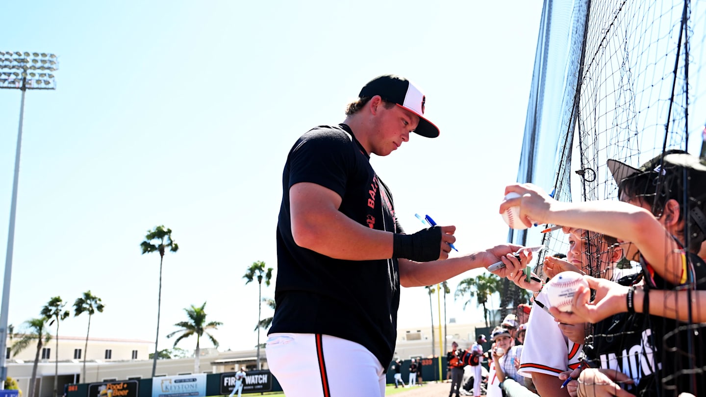 Feb 20, 2026; Sarasota, Florida, USA; Baltimore Orioles infielder Jackson Holliday (7) signs autographs before the start of the spring training game against the  New York Yankees at Ed Smith Stadium. Mandatory Credit: Jonathan Dyer-Imagn Images