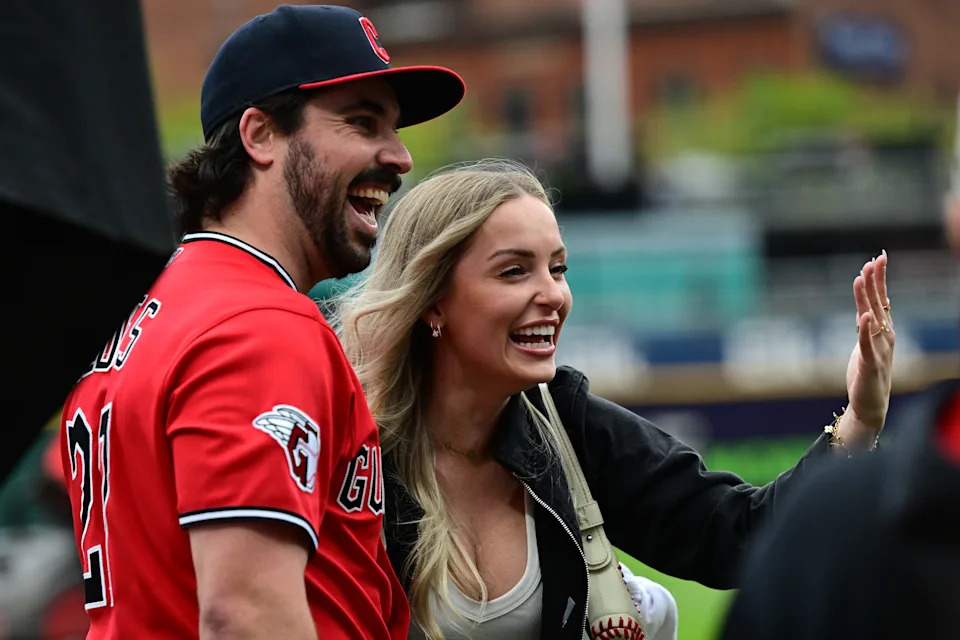 Apr 19, 2026; Cleveland, Ohio, USA; Cleveland Guardians catcher Austin Hedges (27) and fiancée Lexi Dickinson celebrate on the field after a marriage proposal by Hedges after a game against the Baltimore Orioles at Progressive Field. Mandatory Credit: David Dermer-Imagn Images