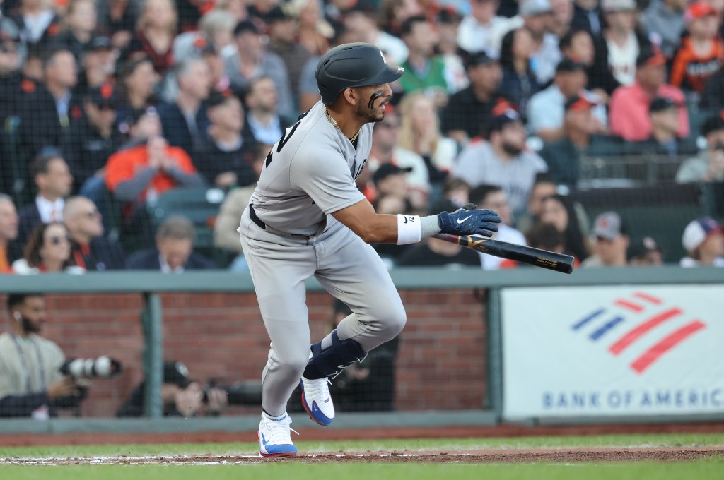 Yankees shortstop José Caballero (72) hits an RBI double during the second inning.