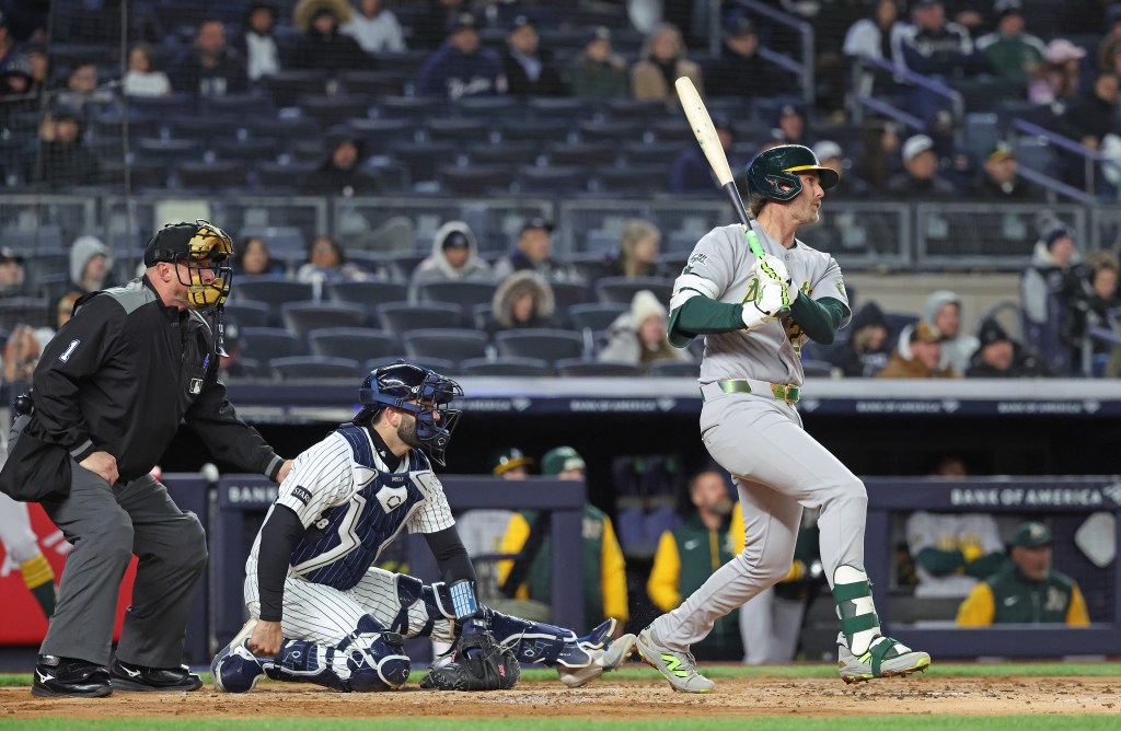 Oakland Athletics second baseman Jeff McNeil (22) hits a single.