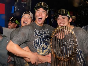 From left: Los Angeles Dodgers' Shohei Ohtani, Yoshinobu Yamamoto and Roki Sasaki celebrate after winning the World Series.