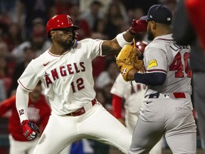 Los Angeles Angels' Jorge Soler and Atlanta Braves' Reynaldo López fight during the fifth inning of Tuesday night's game.