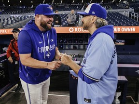 Rogers Game Day Owner Paul Bychko talks with Blue Jays manager John Schneider.