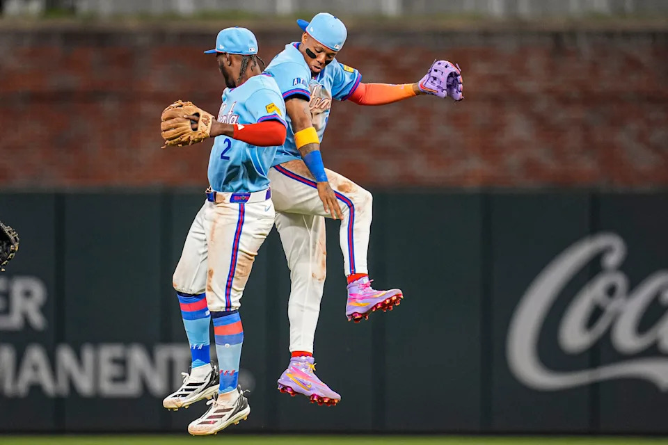 Atlanta Braves right fielder Ronald Acuna Jr. (13) and shortstop Jorge Mateo (2) celebrate after the Braves defeated the Cleveland Guardians on April 12, 2026, in Cumberland, Georgia.