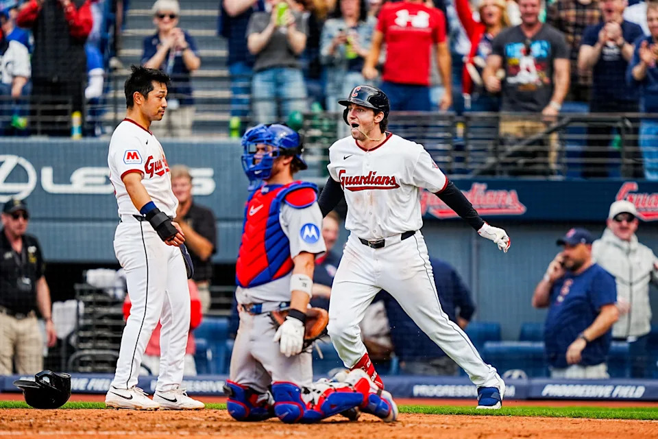 Cleveland Guardians' Chase DeLauter, right, reacts to his two-run home run against the Chicago Cubs during the home opener April 4, 2026, in Cleveland.