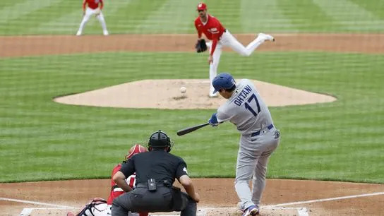 Los Angeles Dodgers two-way player Shohei Ohtani (17) hits a solo home run off of Washington Nationals pitcher Foster Griffin (22) during the third inning at Nationals Park. 