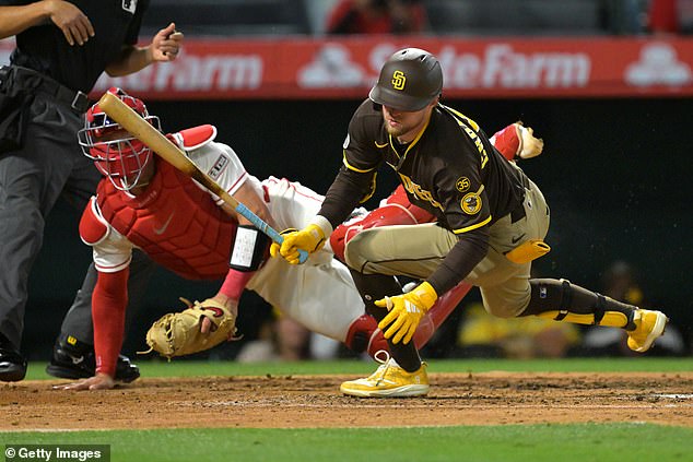 He dropped to the ground in agony after being hit by a high pitch from Angels' Yusei Kikuchi