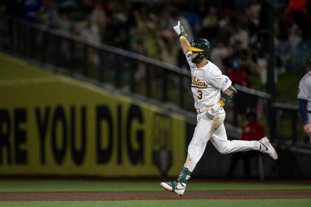 The Athletics’ Max Muncy rounds first base after hitting a home run off Houston Astros pitcher Roddery Muñoz in the fourth inning Friday at Sutter Health Park in West Sacramento.