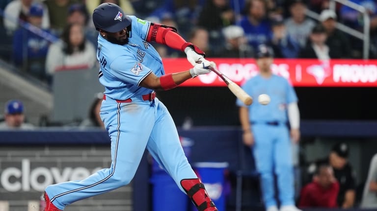 Toronto Blue Jays' Vladimir Guerrero Jr. (27) hits a single...