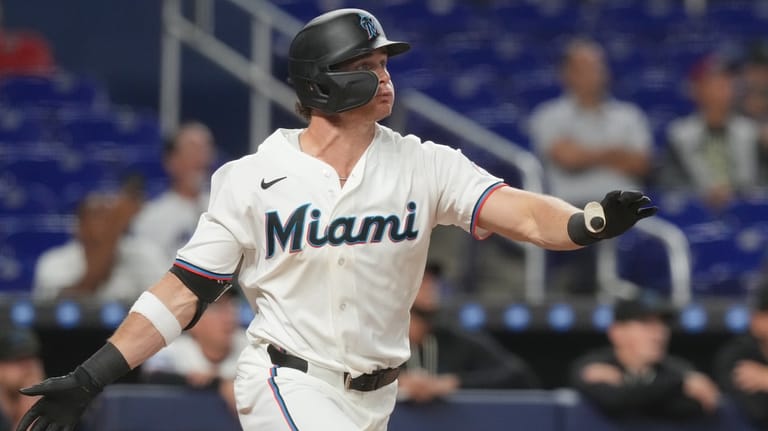 Miami Marlins Griffin Conine hits a two-run home run in...