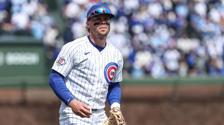 Chicago Cubs second baseman Nico Hoerner (2) warms up before...