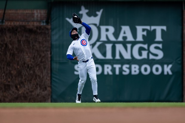 Chicago Cubs left fielder Dylan Carlson catches a fly ball during the third inning of a game against the Los Angeles Angels at Wrigley Field in Chicago on Wednesday, April 1, 2026. (Josh Boland/Chicago Tribune)