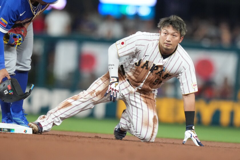 Japan's Seiya Suzuki advances to second base during the first inning of a World Baseball Classic quarterfinal game on Saturday, March 14, 2026, in Miami.