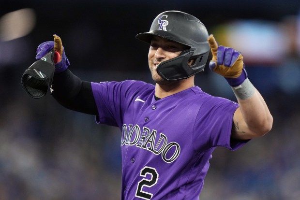 Colorado Rockies Tyler Freeman (2) reacts after hitting an RBI single against the Toronto Blue Jays during tenth inning MLB baseball action in Toronto on Wednesday, April 1, 2026. (Nathan Denette/The Canadian Press via AP)