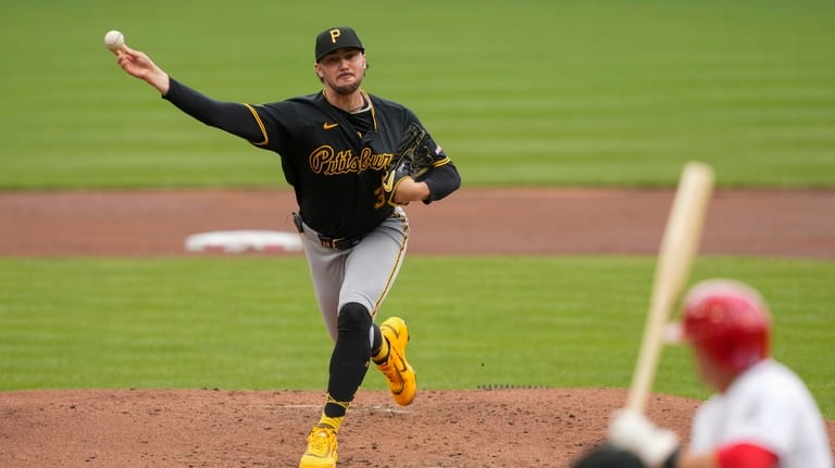 Pittsburgh Pirates pitcher Paul Skenes throws during the first inning...