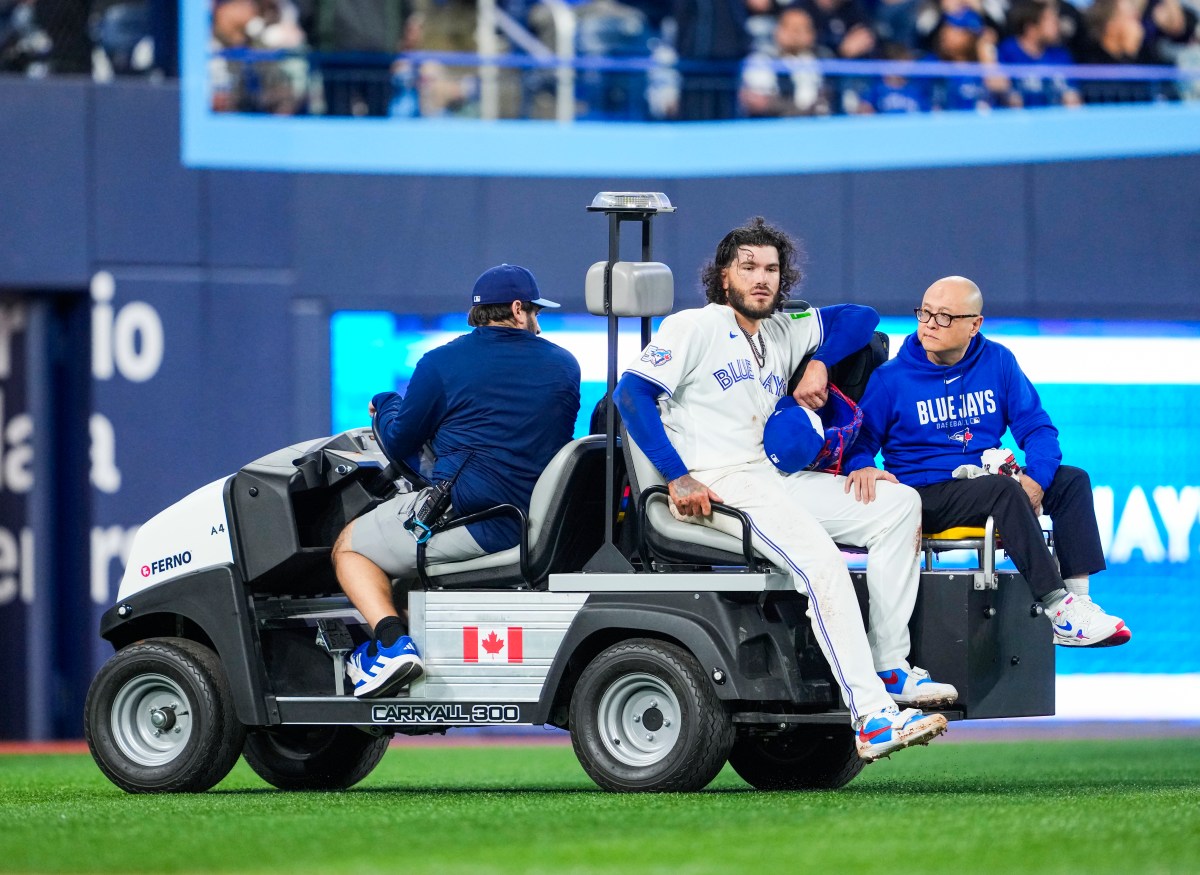 TORONTO, CANADA - MARCH 30: Cody Ponce #66 of the Toronto Blue Jays is carted off the field following an injury against the Colorado Rockies during the third inning in their MLB game at Rogers Centre on March 30, 2026 in Toronto, Ontario, Canada. (Photo by Mark Blinch/Getty Images)