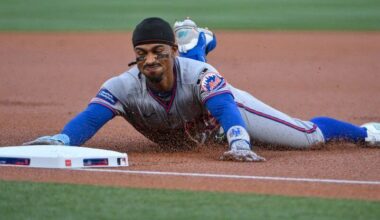 New York Mets shortstop Francisco Lindor (12) slides safely in at third.