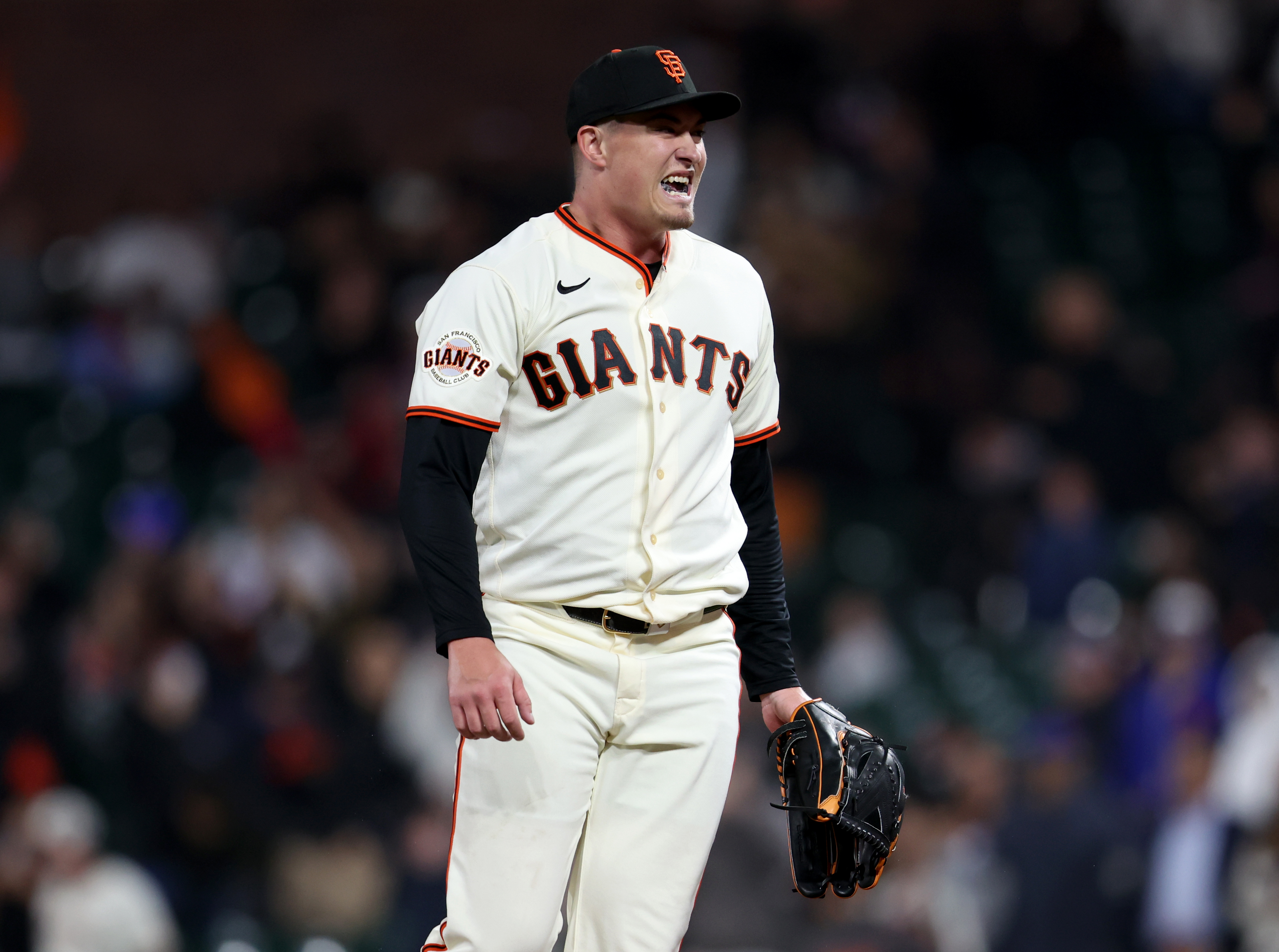 San Francisco Giants relief pitcher Blade Tidwell #46 reacts after...