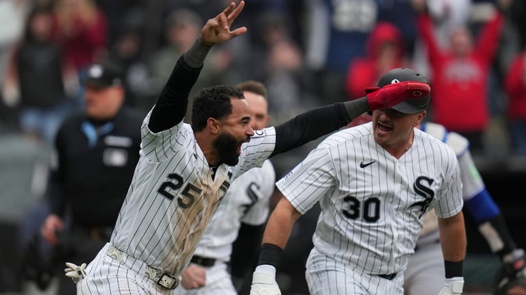 Chicago White Sox's Derek Hill (25) celebrates with Reese McGuire...