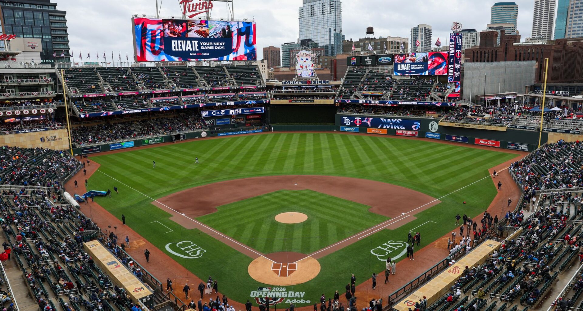 Twins endure a pregame power outage on a cold, rainy day to make for a happy home opener
