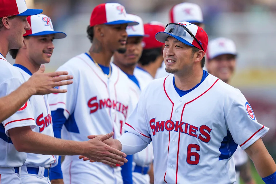 Seiya Suzuki joins his temporary teammates before Opening Day for the Knoxville Smokies at Covenant Health Park. The Japanese-born outfielder is readying for a return to the Chicago Cubs after injuring his knee in the World Baseball Classic.