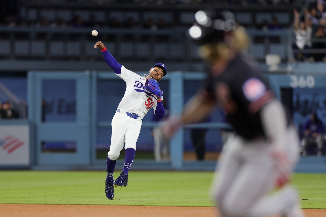 Los Angeles Dodgers infielder Mookie Betts making a throw