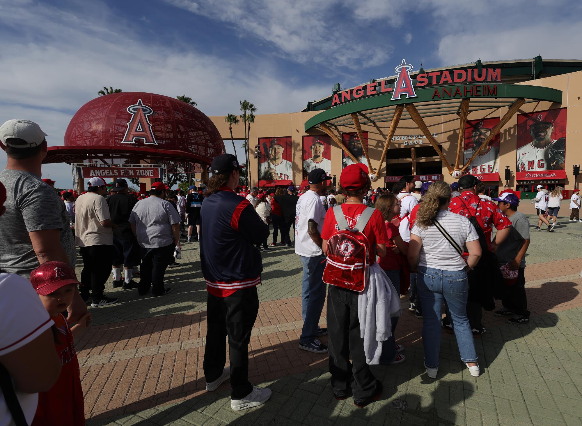 Angels fans stand in front of the stadium before the team's home opener.