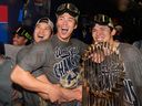 From left: Los Angeles Dodgers' Shohei Ohtani, Yoshinobu Yamamoto and Roki Sasaki celebrate after winning the World Series.
