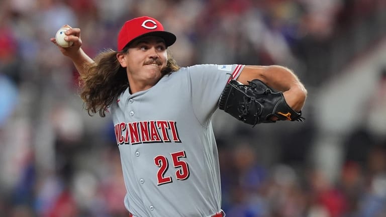 Cincinnati Reds starting pitcher Rhett Lowder throws during the first...