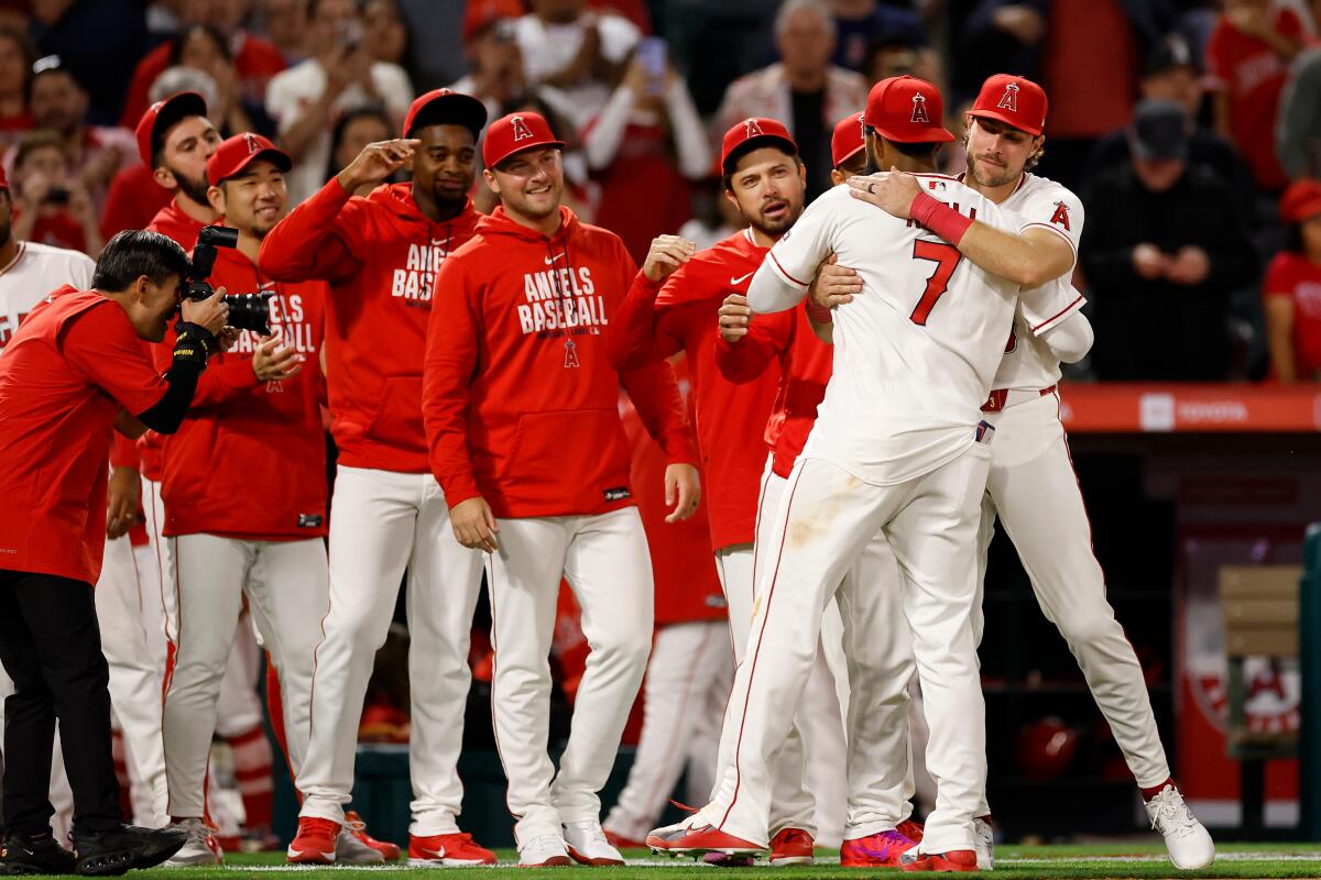 Angels right fielder Jo Adell celebrates with teammates after a 1-0 win over the Seattle Mariners on Saturday.
