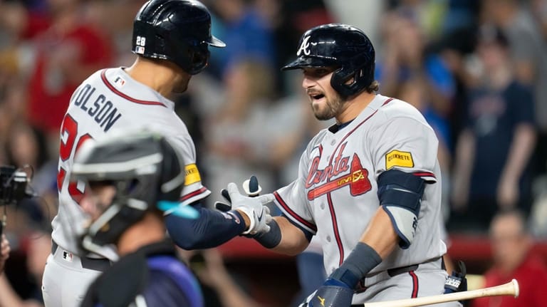 Atlanta Braves third baseman Austin Riley (27) celebrates a home...