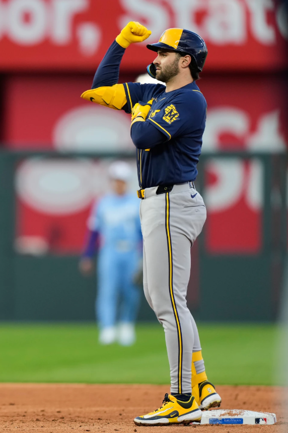 Milwaukee Brewers' Garrett Mitchell celebrates on second after hitting an RBI double during the third inning in the second baseball game of a doubleheader against the Kansas City Royals, Saturday, April 4, 2026, in Kansas City, Mo.